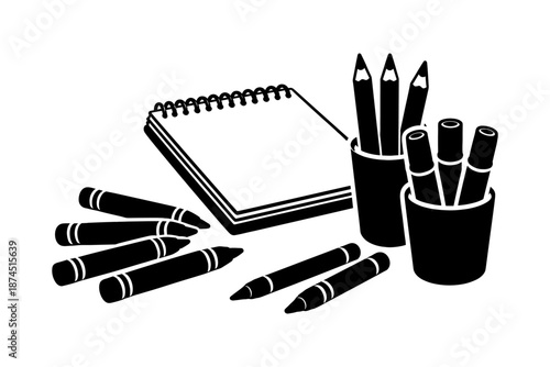 Silhouette of sketchpad and art supplies with pencils and markers
