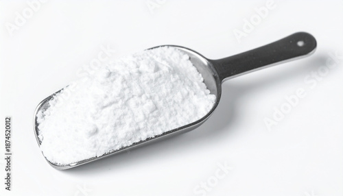 Metal scoop with white powder. Hydrolyzed collagen, sodium benzoate, citric acid, calcium carbonate