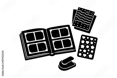 Silhouette scrapbooking kit with open album, stickers, and craft paper