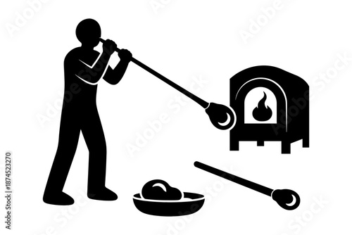 Silhouette of glass blowing artist working near furnace with tools