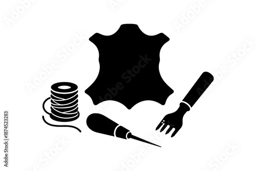Silhouette leather craft tools with stitching awl and cord on white background