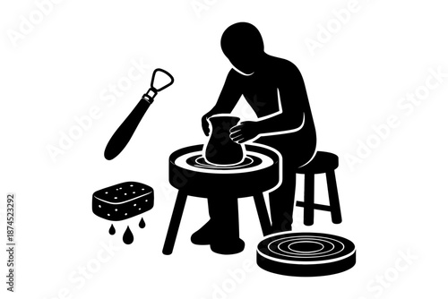 Silhouette of a pottery artist crafting on a wheel