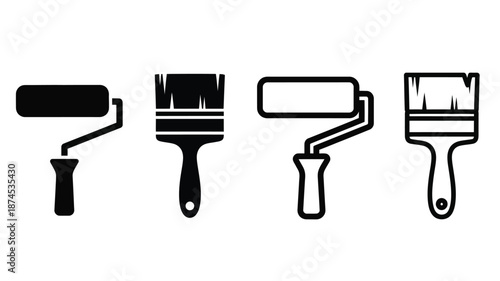 A collection of painting tools including rollers and brushes in black