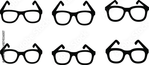 Collection of different shaped eyeglasses displayed in a dark silhouette