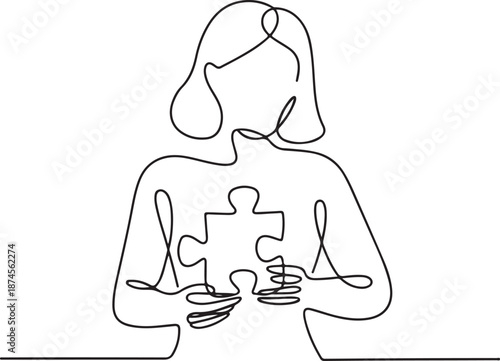 Woman holding a puzzle piece in heart shape representing mental health and personal growth