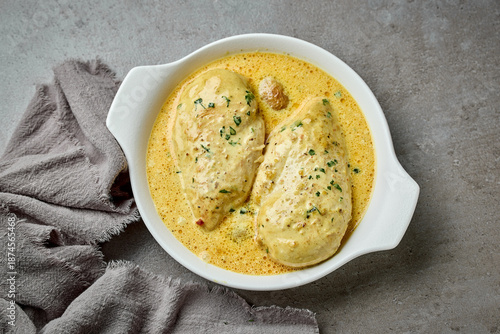 Photography delicious chicken breast meat with creamy sauce in white bowl