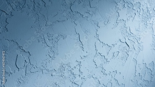Textured blue wall with subtle light and shadow creating depth