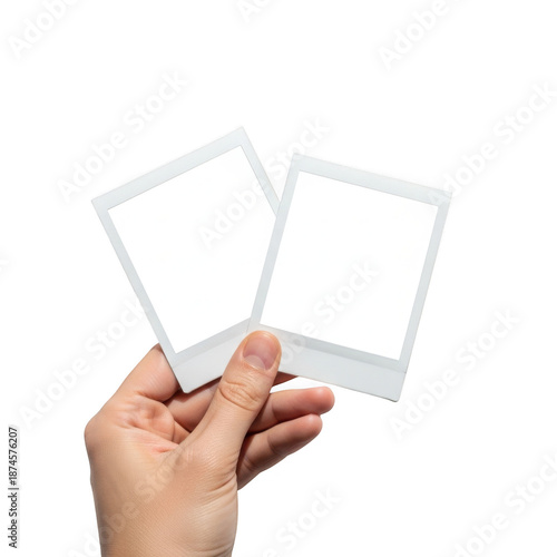Hand holding polaroid frames, isolated on transparent background