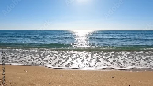 Wallpaper Mural Ocean waves crashing on sandy beach under bright sun. Torontodigital.ca