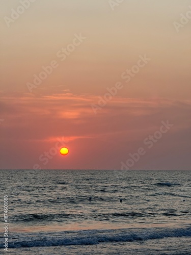 Sunset on a beach, with an orange colour. Very beautiful summer panorama. Golden hour.