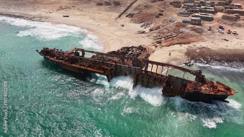 Aerial View of Rusted Shipwreck on Sandy Beach