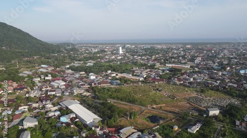 Aerial 4K Drone View of Coastal Town with Green Hills and Cityscape 4K