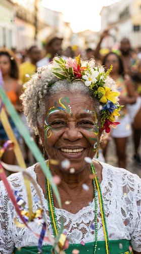 Old woman with curly gray hair, colorful flower crown, white lace top, green beaded necklace, face painted with green and yellow patterns, smiling, confetti, outdoor street festival.