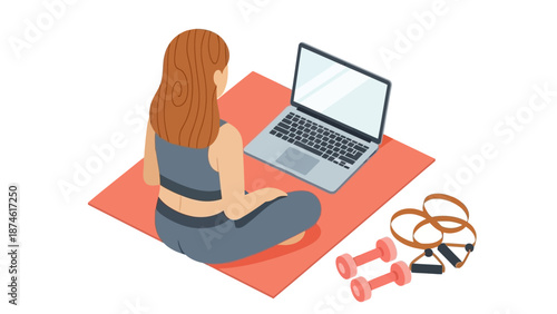 Woman practicing home fitness on yoga mat with laptop and dumbbells