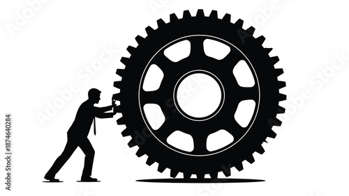 Silhouette of businessman pushing a massive black gear symbolizing effort and industrial process