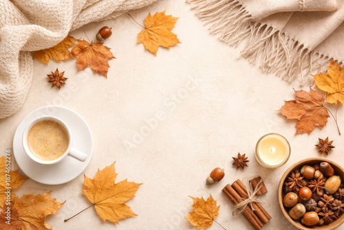 Cozy autumn flat lay with dried maple leaves, acorns, cinnamon sticks, star anise, candle, and a cup of coffee on a soft neutral background. Warm light, soft textures, and minimal composition create a