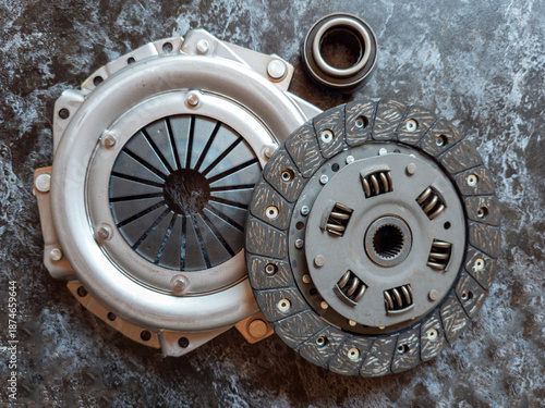 Set of clutch components for manual transmission including pressure plate clutch disc and release bearing arranged.