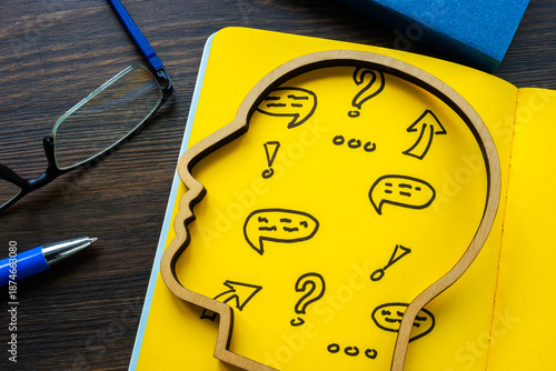 Head with symbols representing critical thinking.