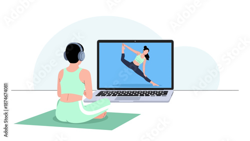 Woman practicing online yoga class at home with laptop and headphones