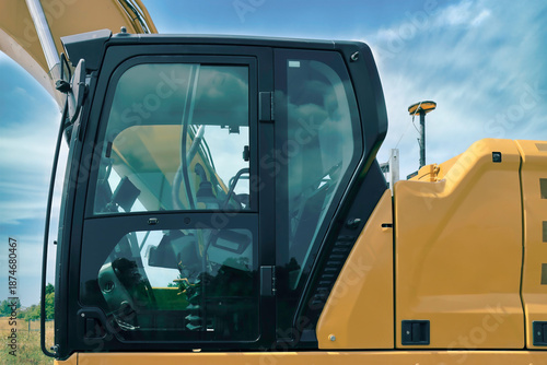 Side view exterior of a yellow construction excavator outside, nobody
