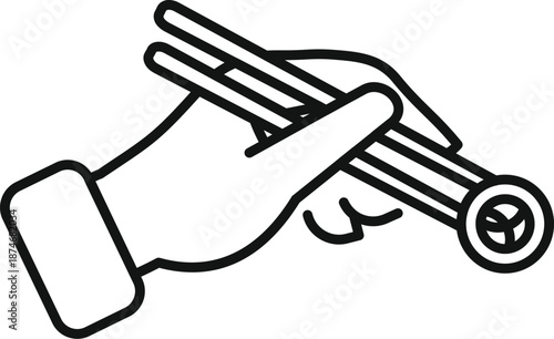 Hand holding chopsticks lifting a piece of sushi, representing asian cuisine and dining