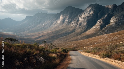 Majestic Mountain Landscape with Dramatic Sky over Winding Road and Scenic Valley in Natural Setting of South Africa's Beautiful Highlands