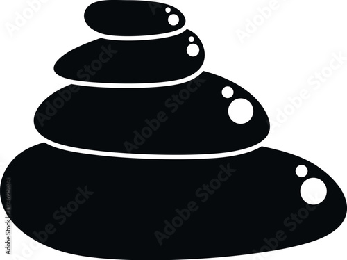 Stacked smooth black stones representing balance, relaxation, and wellness