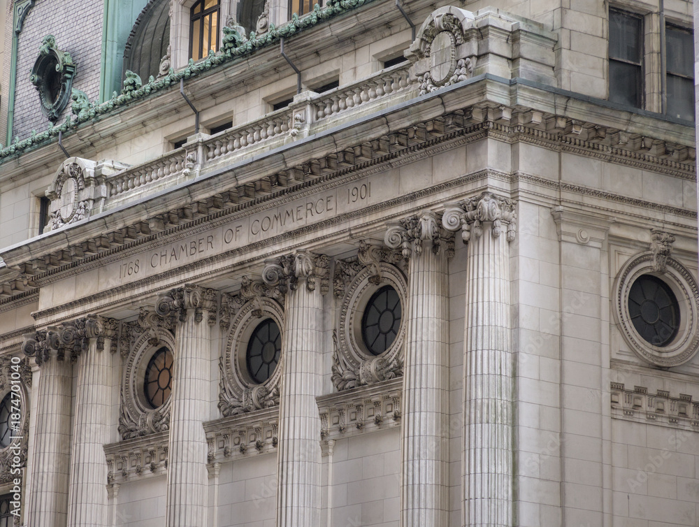 Fototapeta premium Chamber of Commerce building facade near Wall Street in Manhattan, New York City, United States of America. Famous American financial institution.
