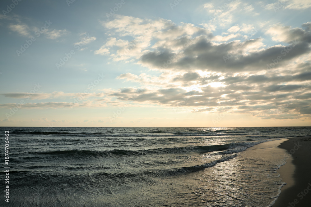 Fototapeta premium Picturesque view of beautiful sky with clouds over tropical beach at sunset