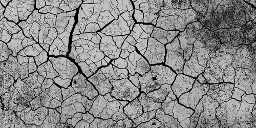 Dry cracked bark of old wood creates a brown natural pattern on arid desert ground during a summer climate drought