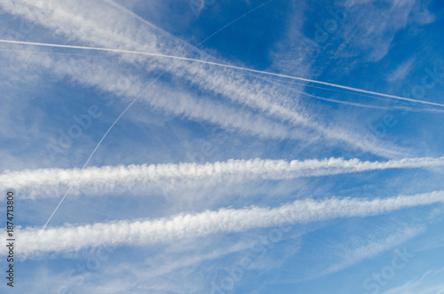 Condensation Trails From Aircraft in High Altitude Sky
