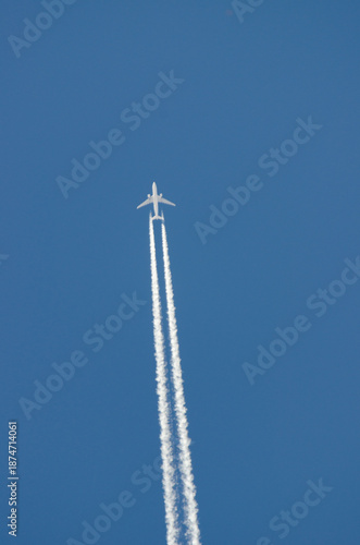 Aircraft Leaving One Condensation Trail in Clear Blue Sky