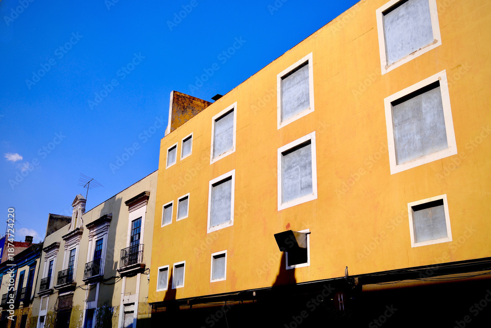 Fototapeta premium Yellow Corner Building with Repeating Windows (Puebla, Mexico)