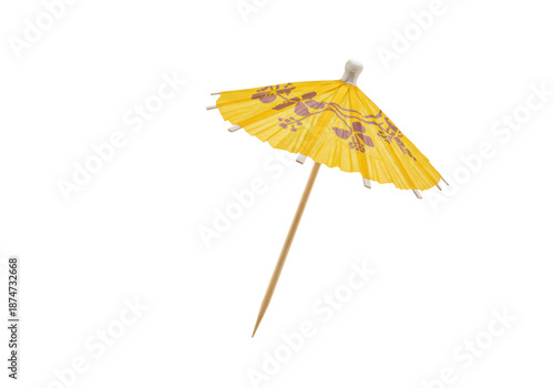 Pristine deep yellow paper cocktail umbrella, purple floral design, wood stick, transparent background, soft shadow, copy space. Concept for tropical beverage garnish