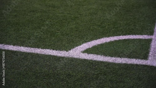 Super slow-motion video of the corner of a soccer field. 100fps