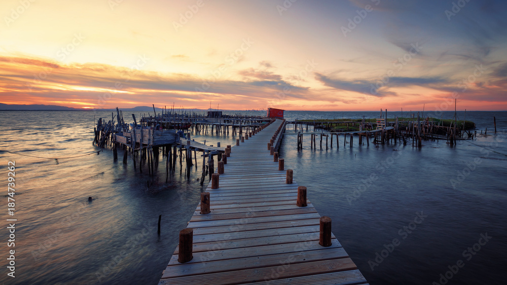 Fototapeta premium Traditional palafitic pier at sunset