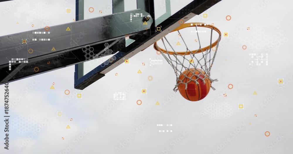 Fototapeta premium Descending orange basketball passing through net at outdoor court, with rim, overlay, copy space