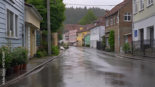 Rainy street view from local home window with firefly, 2197