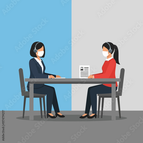 Two women in face masks and headsets conducting an interview or meeting at a table.