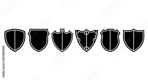 Set of six black and white medieval shield icons with different designs.