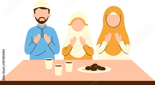 Muslim family praying Iftar