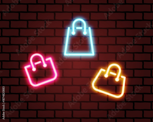 Neon shopping bag icons on a dark brick wall background. Vibrant blue, pink, and yellow glowing light signs for retail marketing, night sale promotions, and fashion e-commerce banners.
