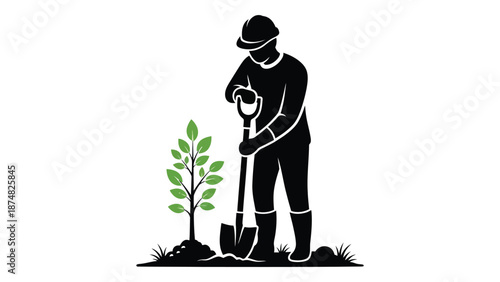 A silhouette of a person planting a young tree with a shovel