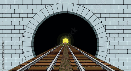 Railway train tracks leading into a dark tunnel with a bright glowing yellow light at the end of the exit.