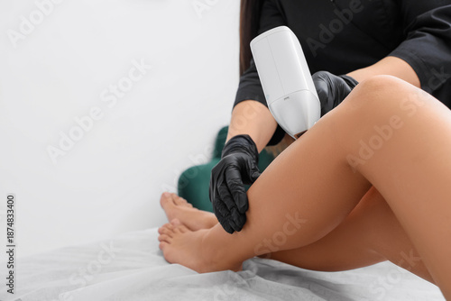 Female cosmetologist perfor...