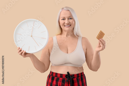 Mature woman with clock and...