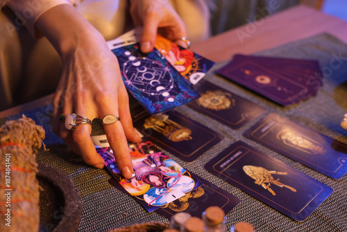 Cuadro en lienzo Fortune teller reading tarot cards at table in room, closeup