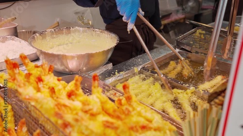 Chef frying tempura shrimp, a famous Japanese food for the tourists