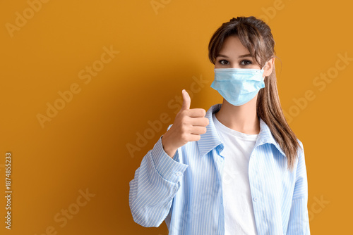 Young woman in medical mask...