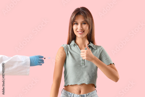 Young woman showing thumb-u...